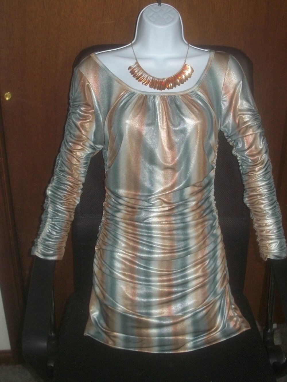 womens shiny long sleeved top.scrunch.ruched.cut out back.size medium